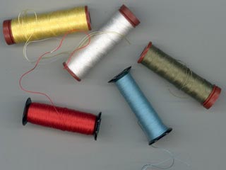 Fil à coudre sur fusettes