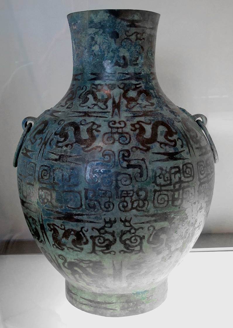 Vase hu pour conserver les boissons fermentées, bronze avec incrustation de cuivre, dynastie des Zhou de l'ouest, époque des Royaumes Combattants.